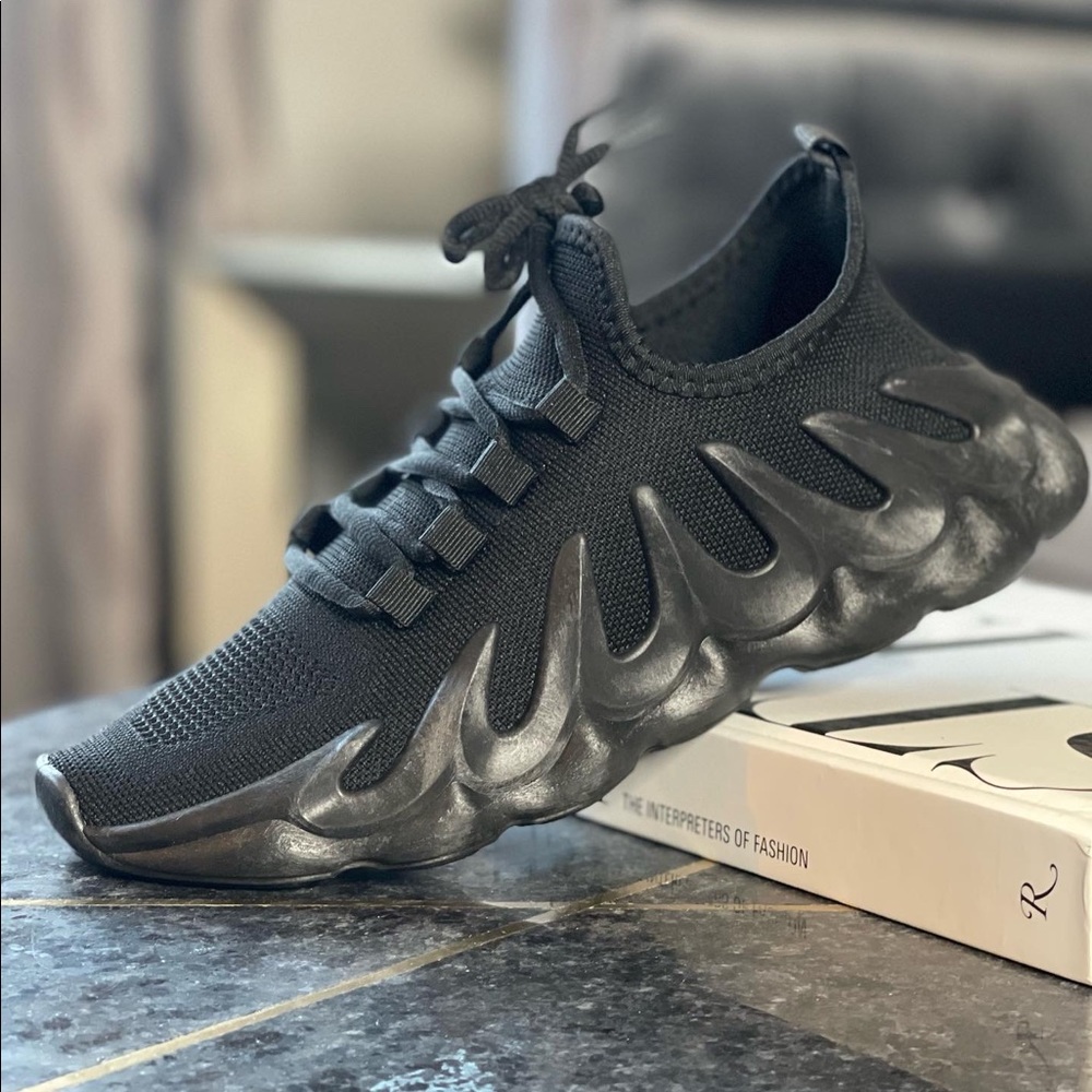 NEW w/box. Black designer inspired sneaker.